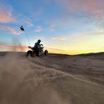 ATV at the sand dunes at sunset in St. Anthony